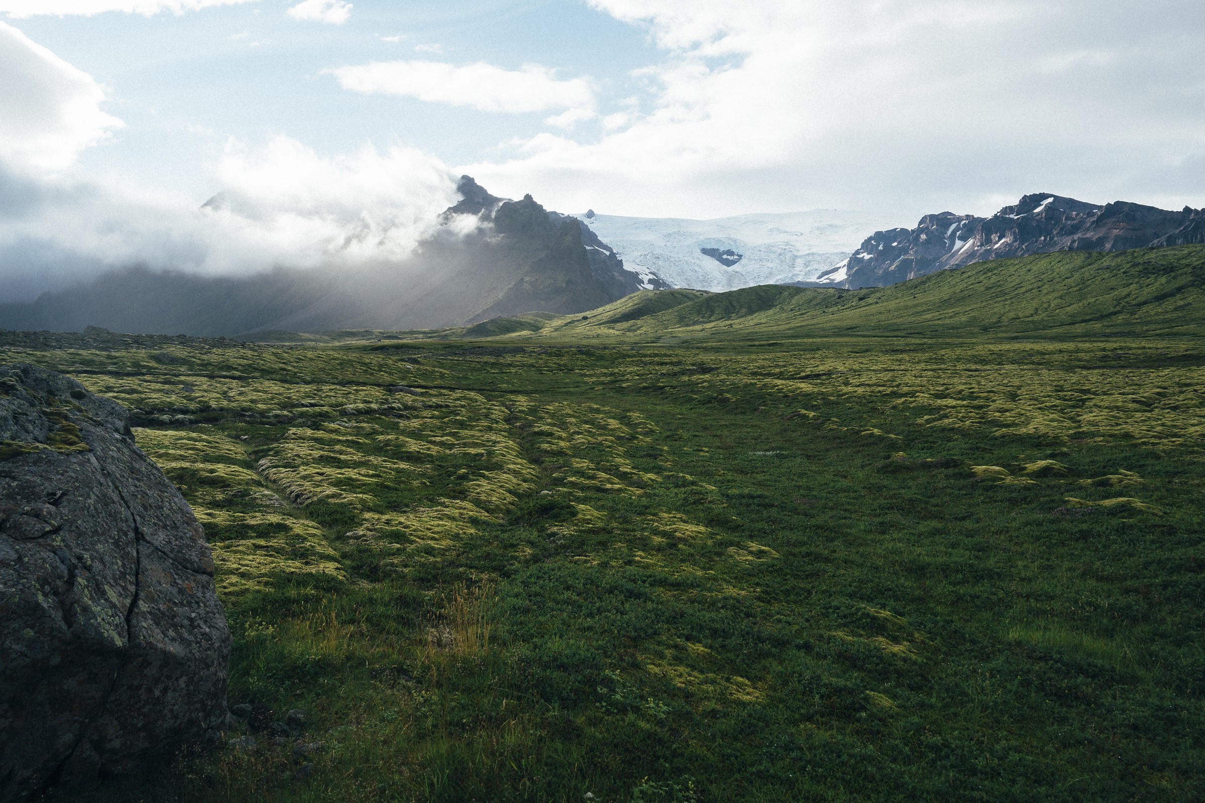 Cloudy mountains and green meadow before resizing, 2400 by 1600 pixels
